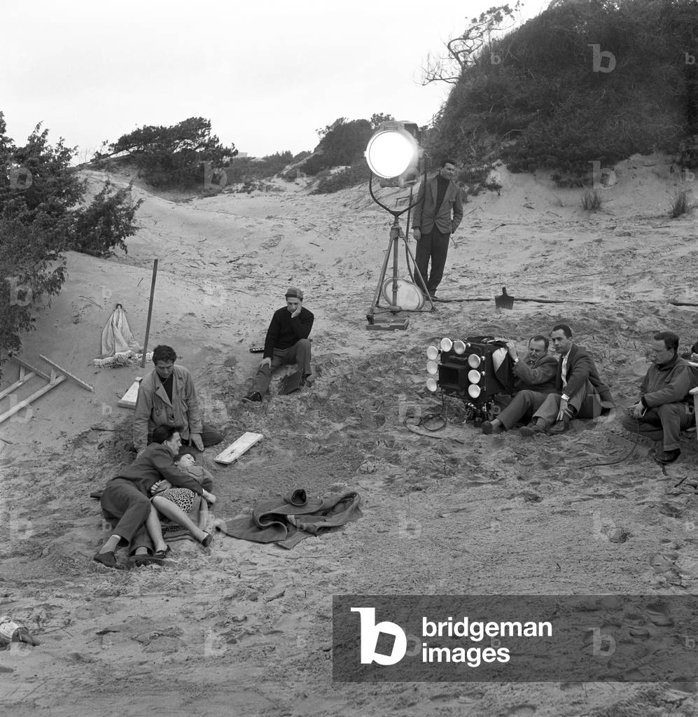 Italian director Michelangelo Antonioni with his crew on the set of the film 'The Girlfriends', Italy, 1955 (b/w photo)