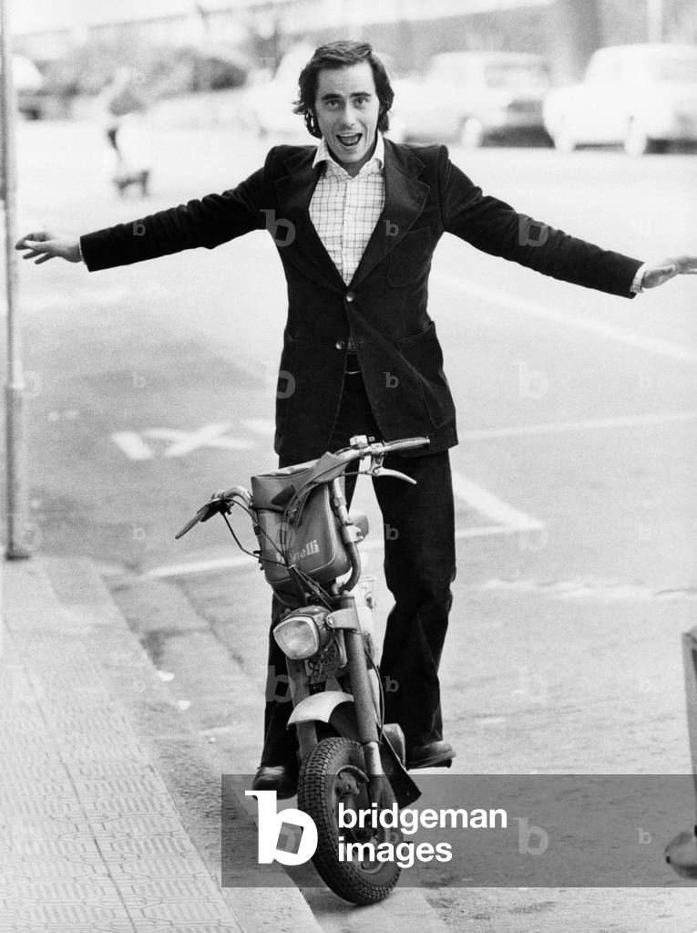 Roberto Vecchioni on a moped, Sanremo, Italy, 1973