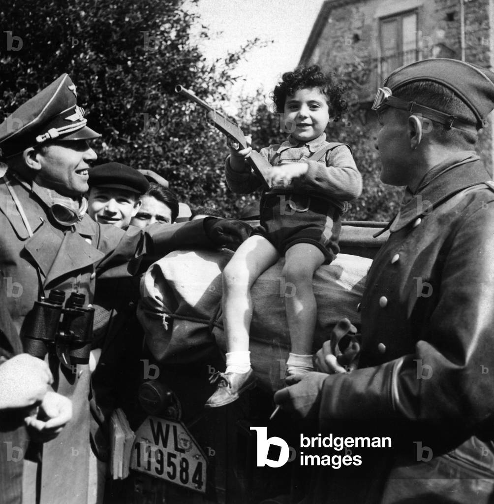 German officers with Italian child