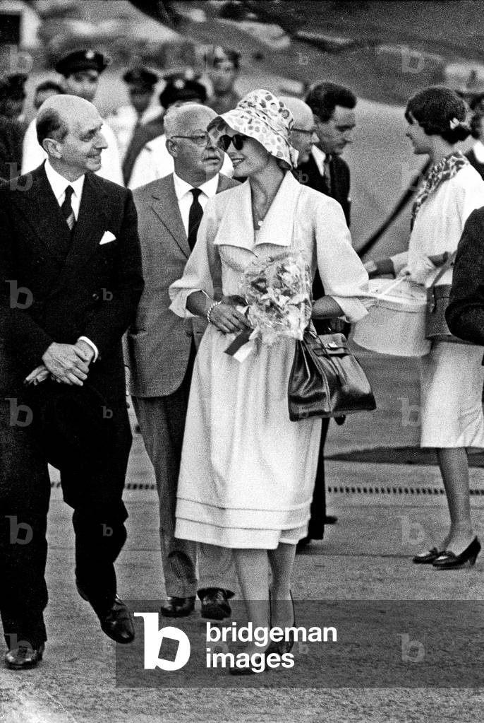 Grace Kelly arriving at Ciampino Airport, Ciampino, Italy, 1959 (b/w photo)