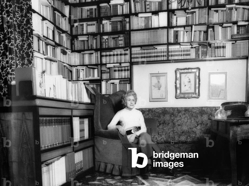 Writer Gianna Manzini is seated in an armchair