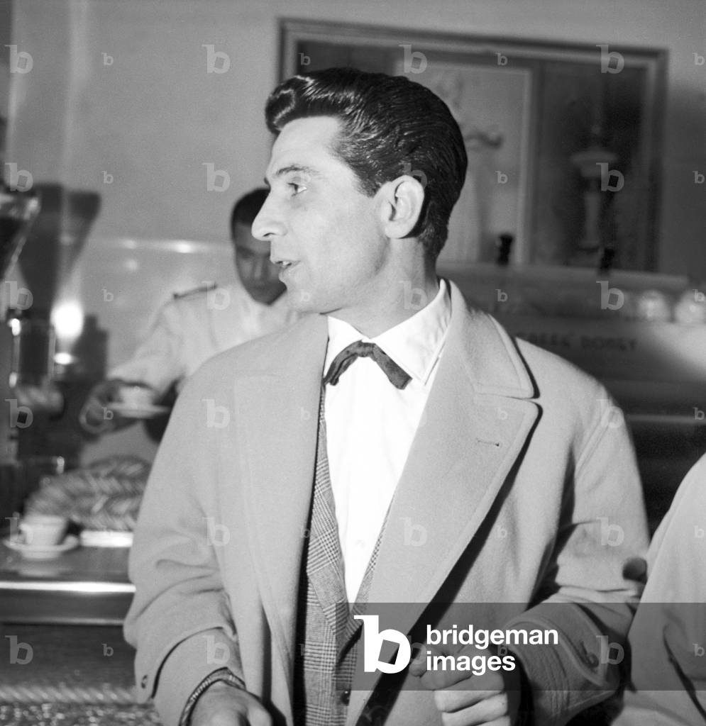 Gilbert Becaud in a cafe of Rome city centre, Italy, 1958 (b/w photo)