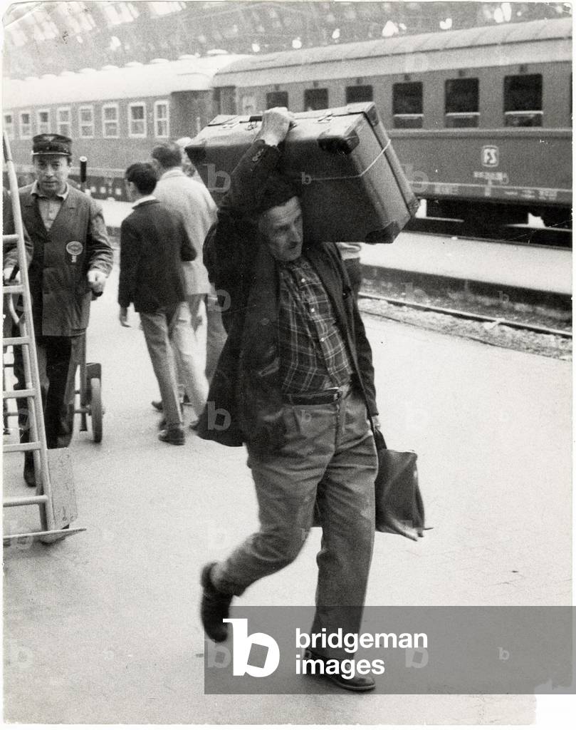 A man carrying a luggage on a platform of the Central Station