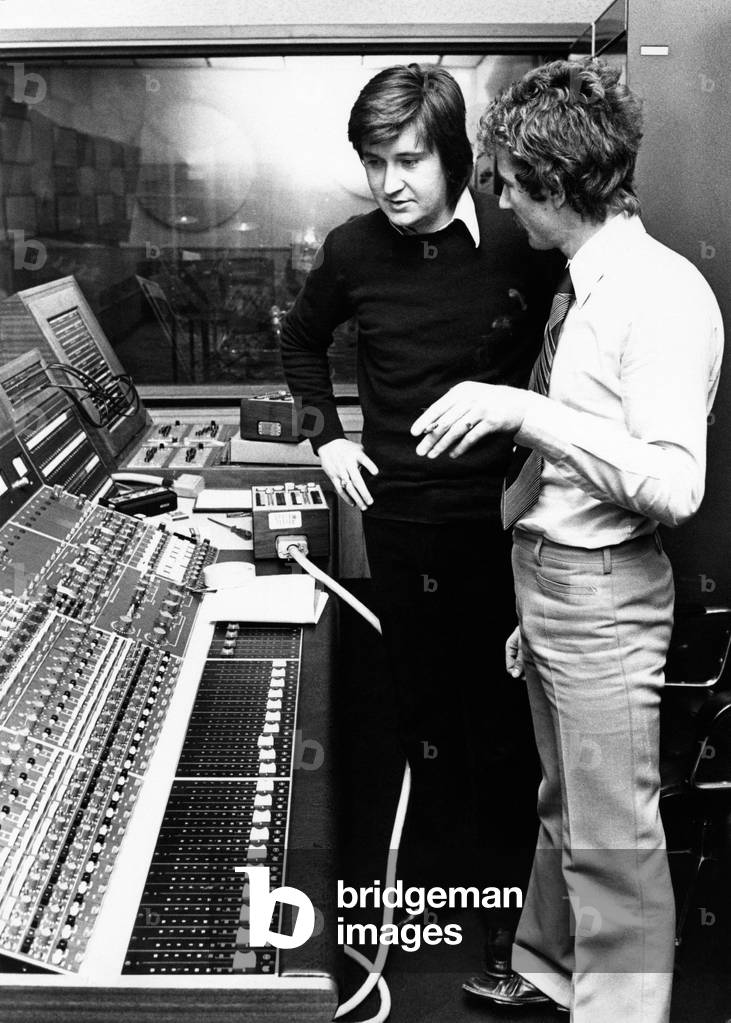 Bobby Solo beside a console in a recording studio