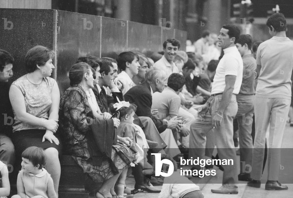 People in Milan on August 15th, Italy, 1968 (b/w photo)