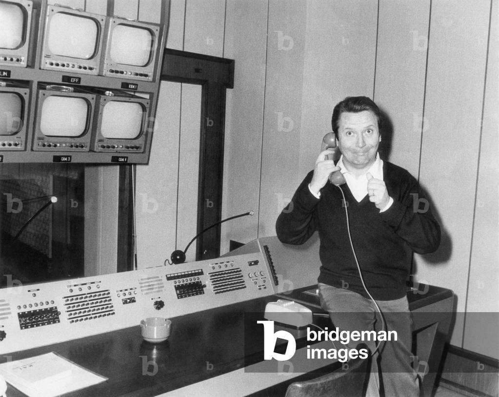 Alighiero Noschese seated in a production room, Italy