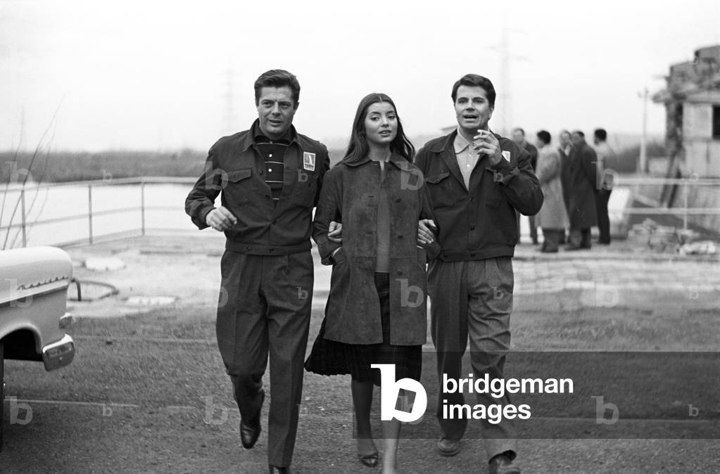 Marcello Mastroianni, Gabriele Ferzetti and Jacqueline Sassard walking on the set of Everyone's in Love, Italy, 1958 (b/w photo)