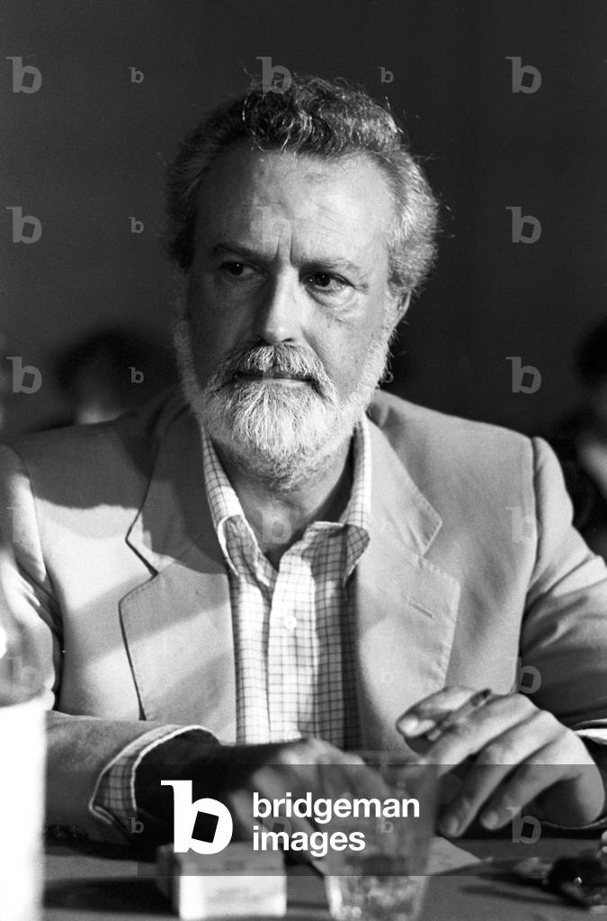 Eugenio Scalfari sitting with a cigarette in his hand