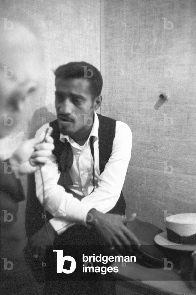 Sammy Davis Jr. being interviewed (b/w photo)