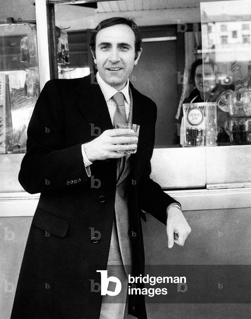 Pippo Baudo drinking some water