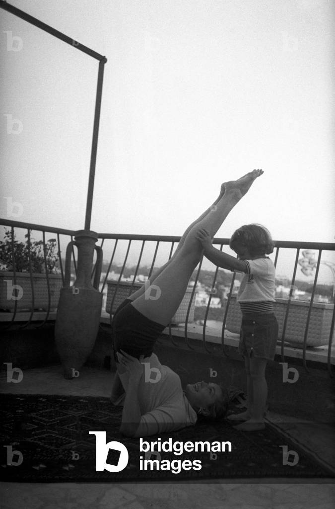 Esther Williams and her daughter doing exercises on the terrace