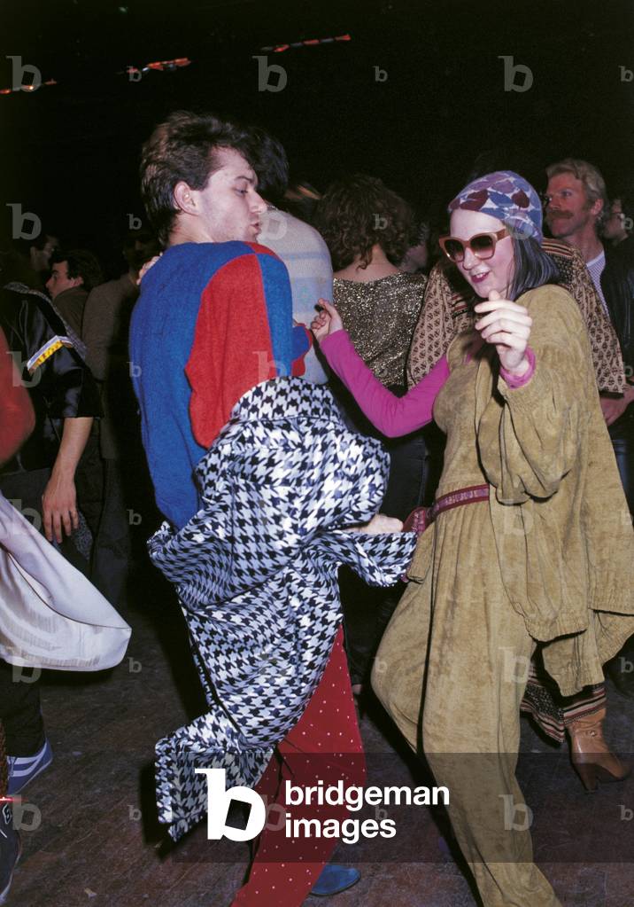 Two young people dressed up are dancing, Milan, Italy
