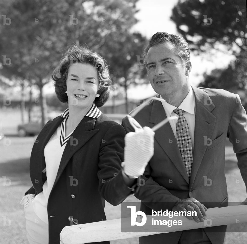 Rossano Brazzi and Dawn Addams attending a match of polo, Italy, 1957 (b/w photo)