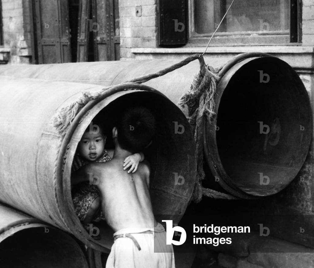 Two kids in the sewers tubes