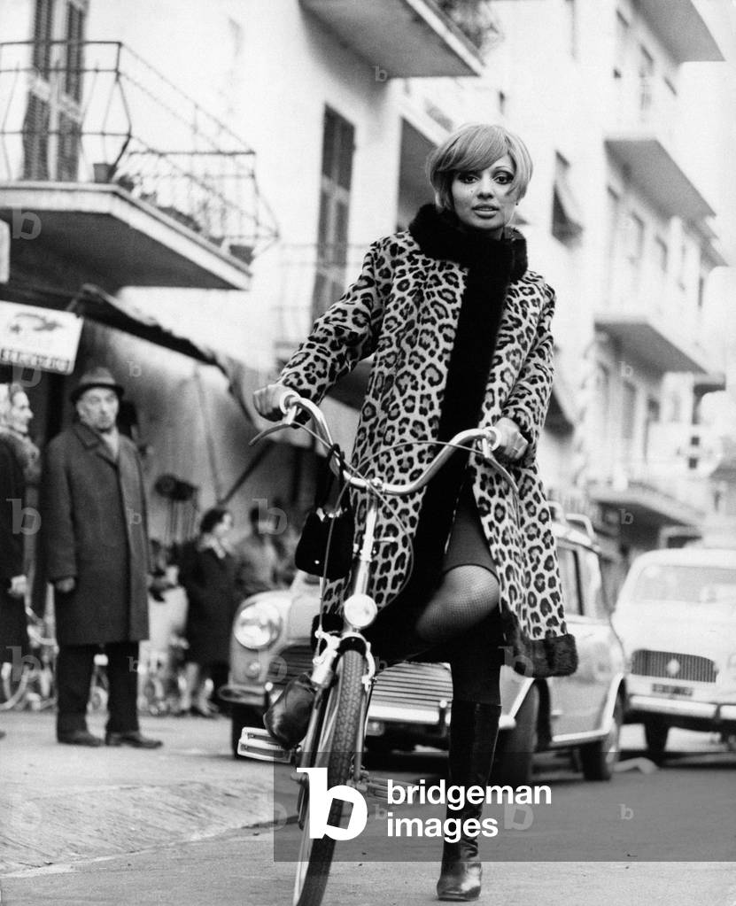 Lara Saint Paul on a bicycle