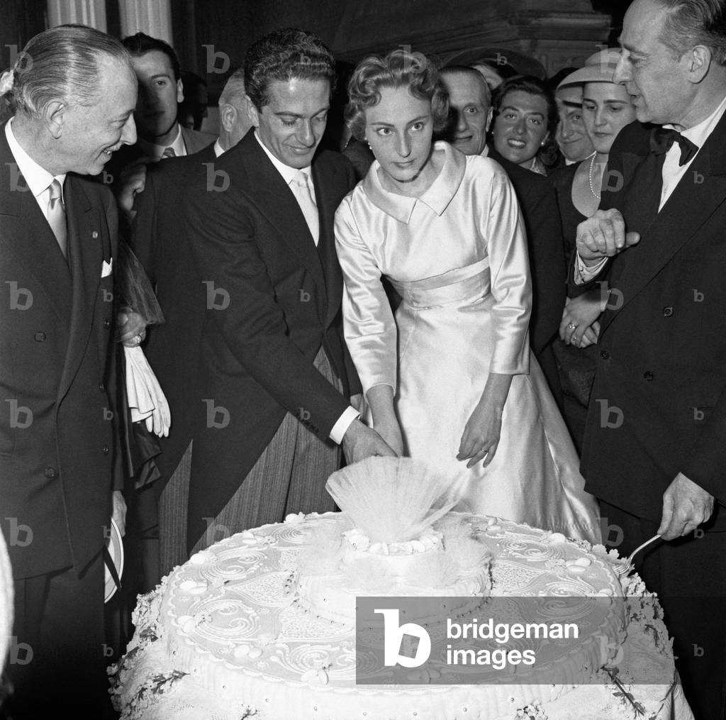Luigi Filippo d'Acquarone and Emanuela Castelbarco slicing their wedding cake , Milan, Italy