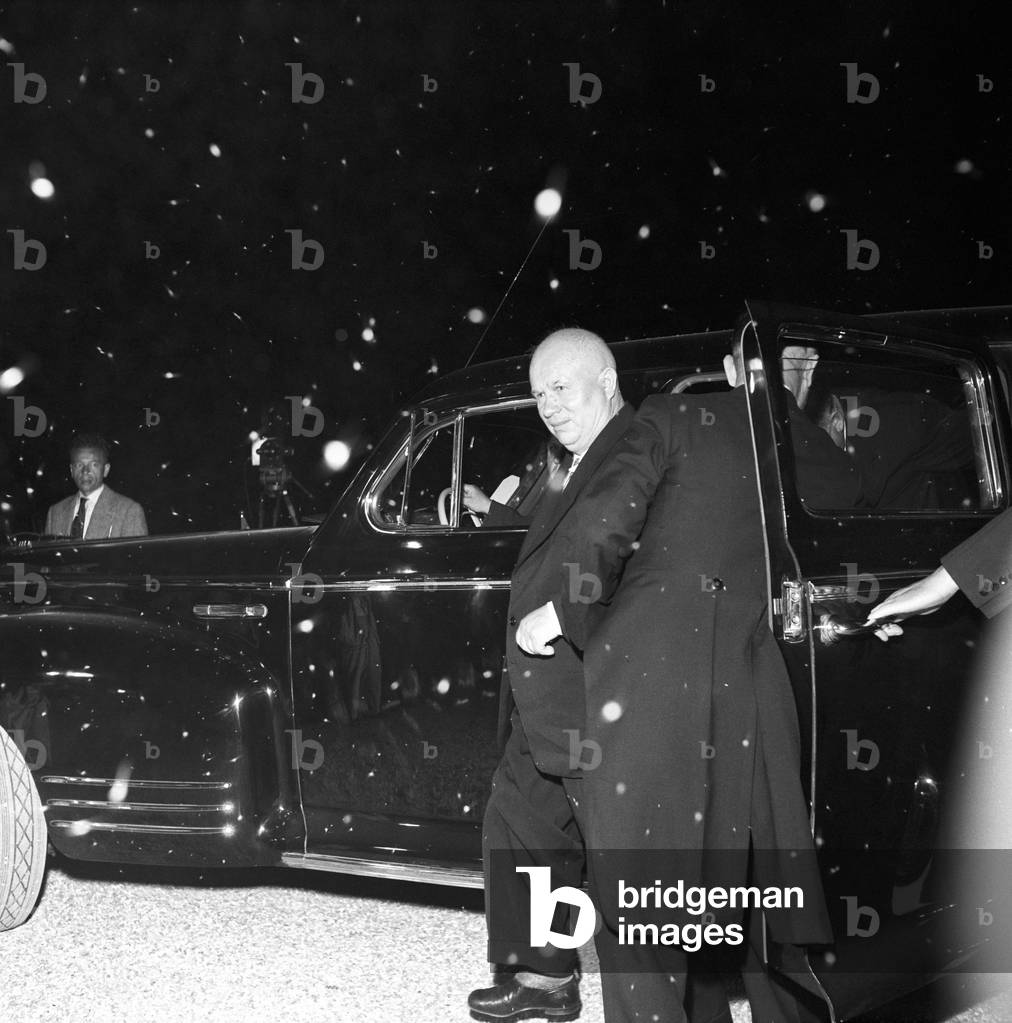 Nikita Khrushchev jumping off a car at the Geneva Summit, Geneva, Switzerland