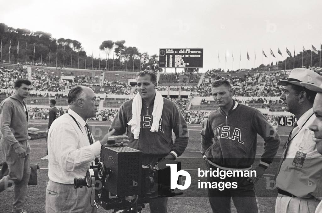 American athletes near a camera, Rome, Italy, 1960 (b/w photo)
