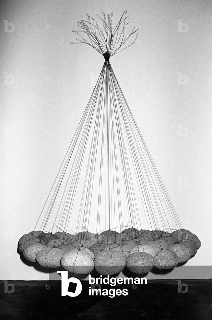 Some stones held in suspension by wires