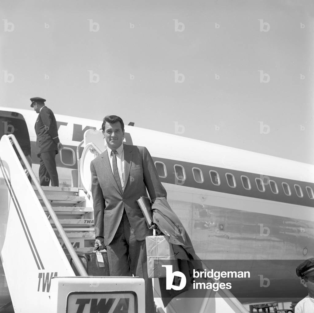 Rock Hudson posing on the aircraft ladder (b/w photo)