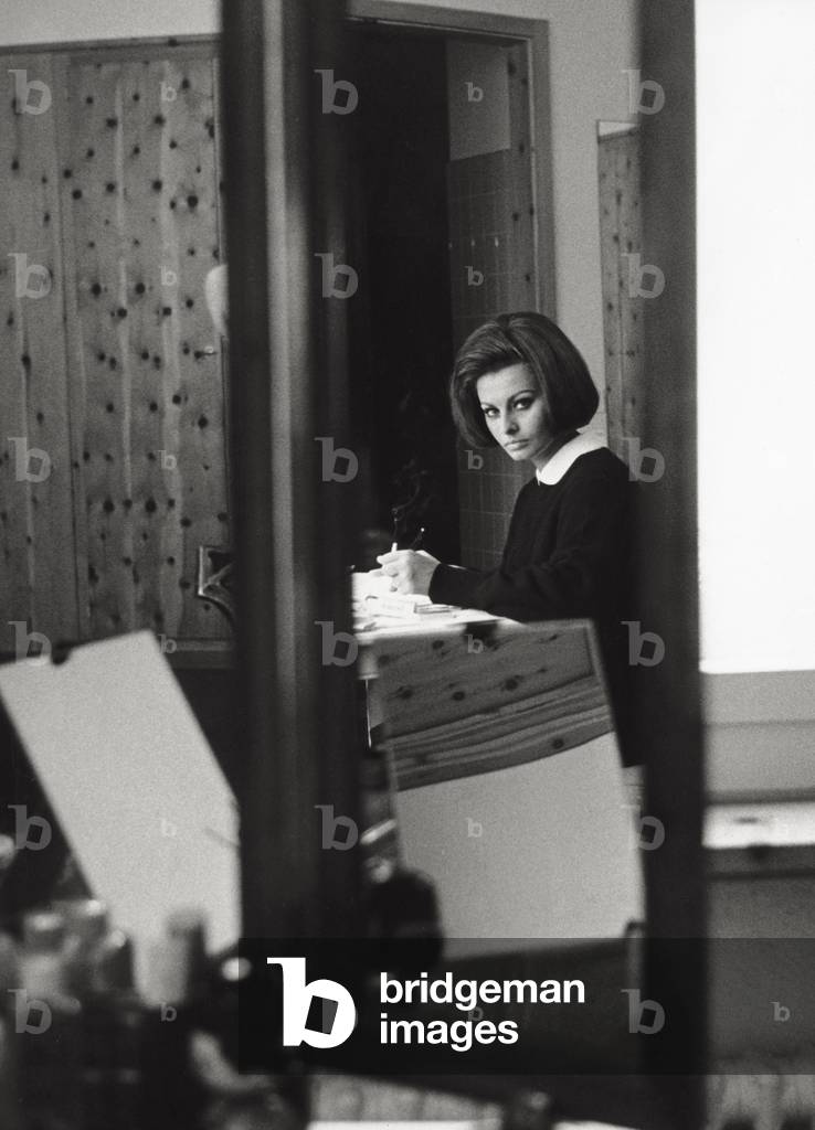 Sophia Loren in her lodge in Switzerland, 1963 (b/w photo)