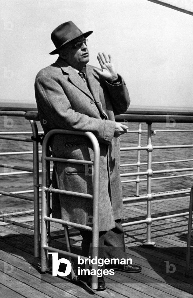 Giuseppe Ambrosini leaning on a parapet