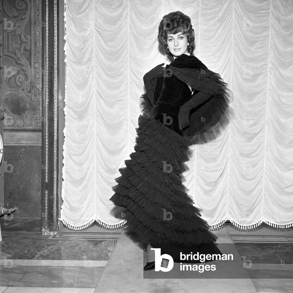 Silvana Pampanini trying on a dress by Valentino, Italy, 1956 (b/w photo)