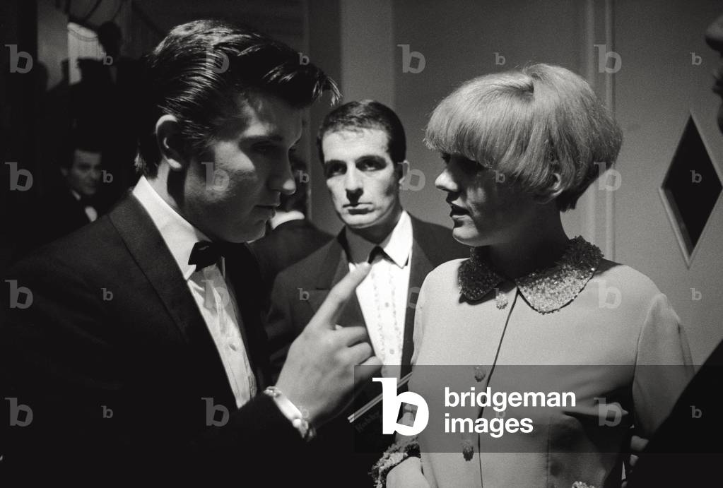 Bobby Solo and Caterina Caselli are chatting in the backstage of the Sanremo Song Festival, 1966 (b/w photo)