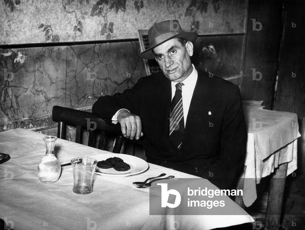 Italian-American mafioso at a restaurant