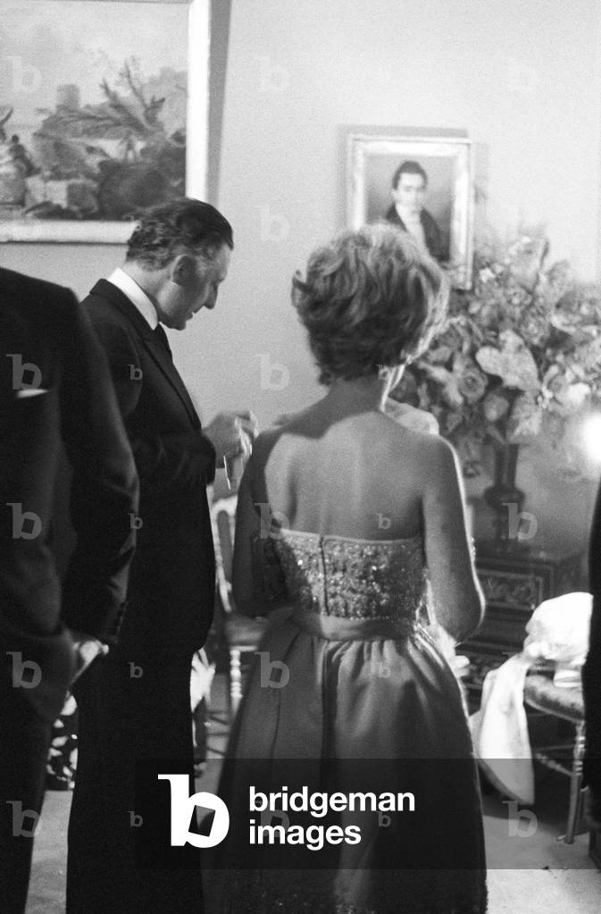 Gianni Agnelli attending a party at Pierre Cardin's fashion house, France, Paris, 1964 (b/w photo)