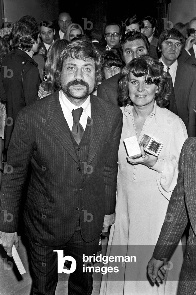 Robert Oliver Reed with his wife Kate Byrne outside of the Teatro Sistina, Rome, Italy, 1968 (b/w photo)