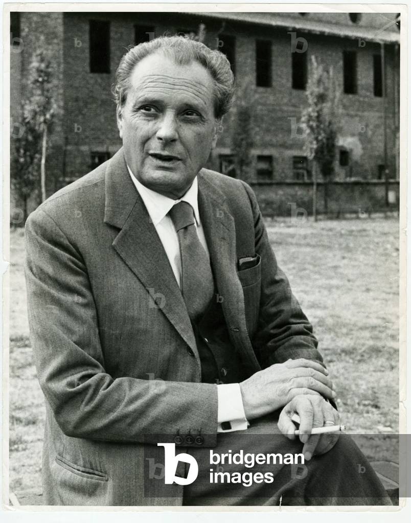 Vittorio Sereni seated with a cigarette in his hand