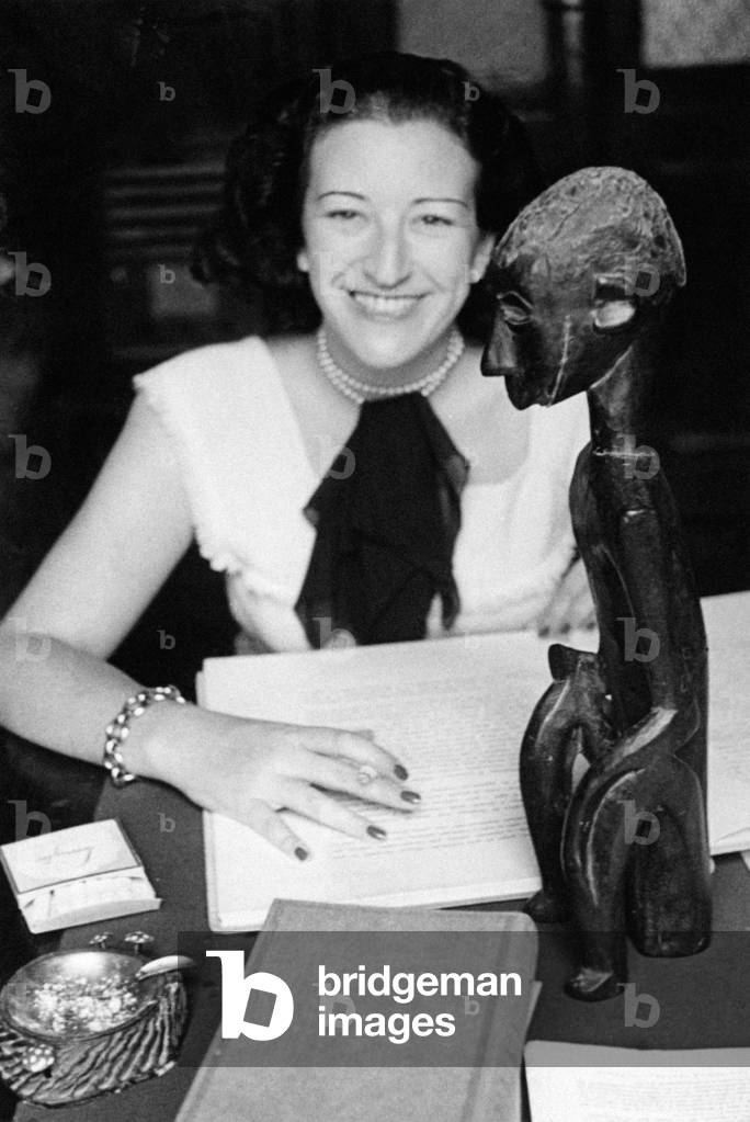 Writer Maria Luisa Spaziani seated at a table