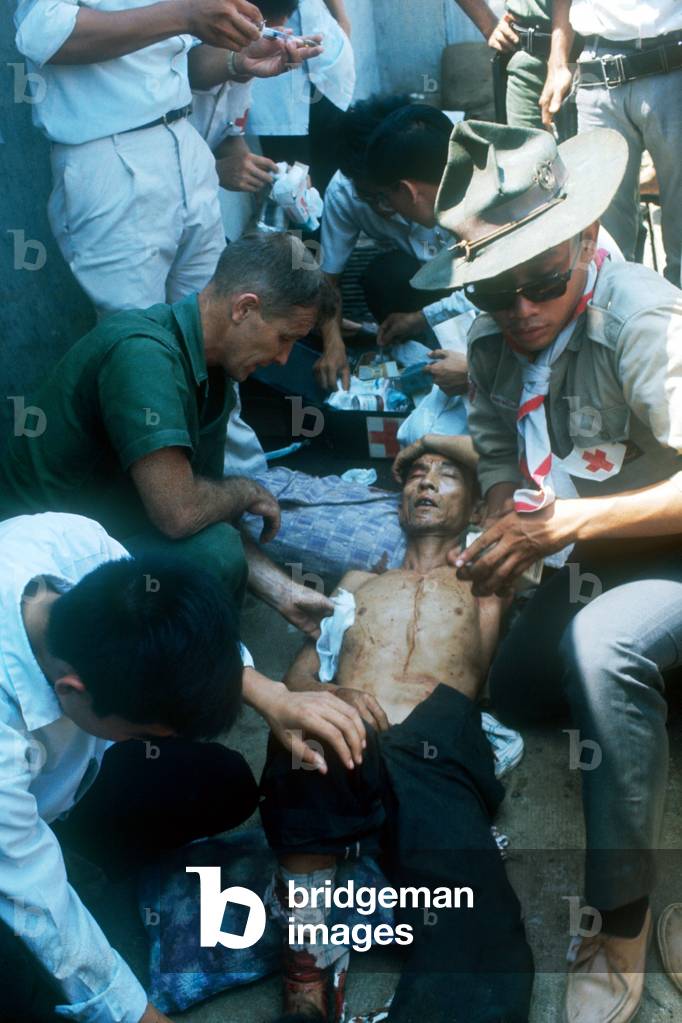 Aid being given to an injured civilian in Saigon