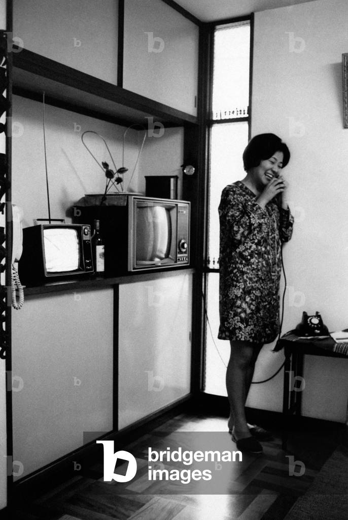 Japanese woman speaking over the phon, Japan, 1970 (b/w photo)