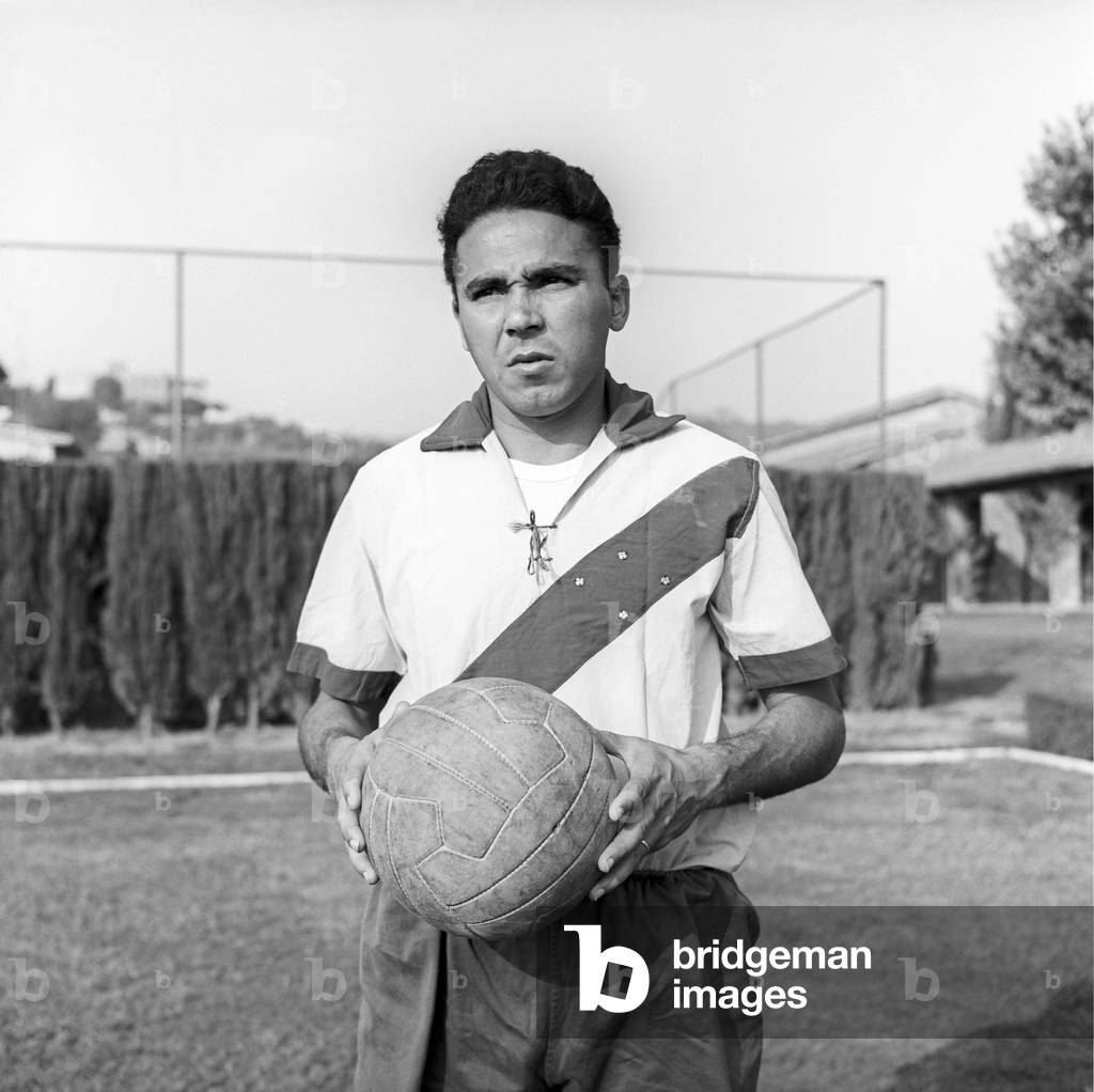 Sidney Colonia Cunha posing with a soccer ball, Italy