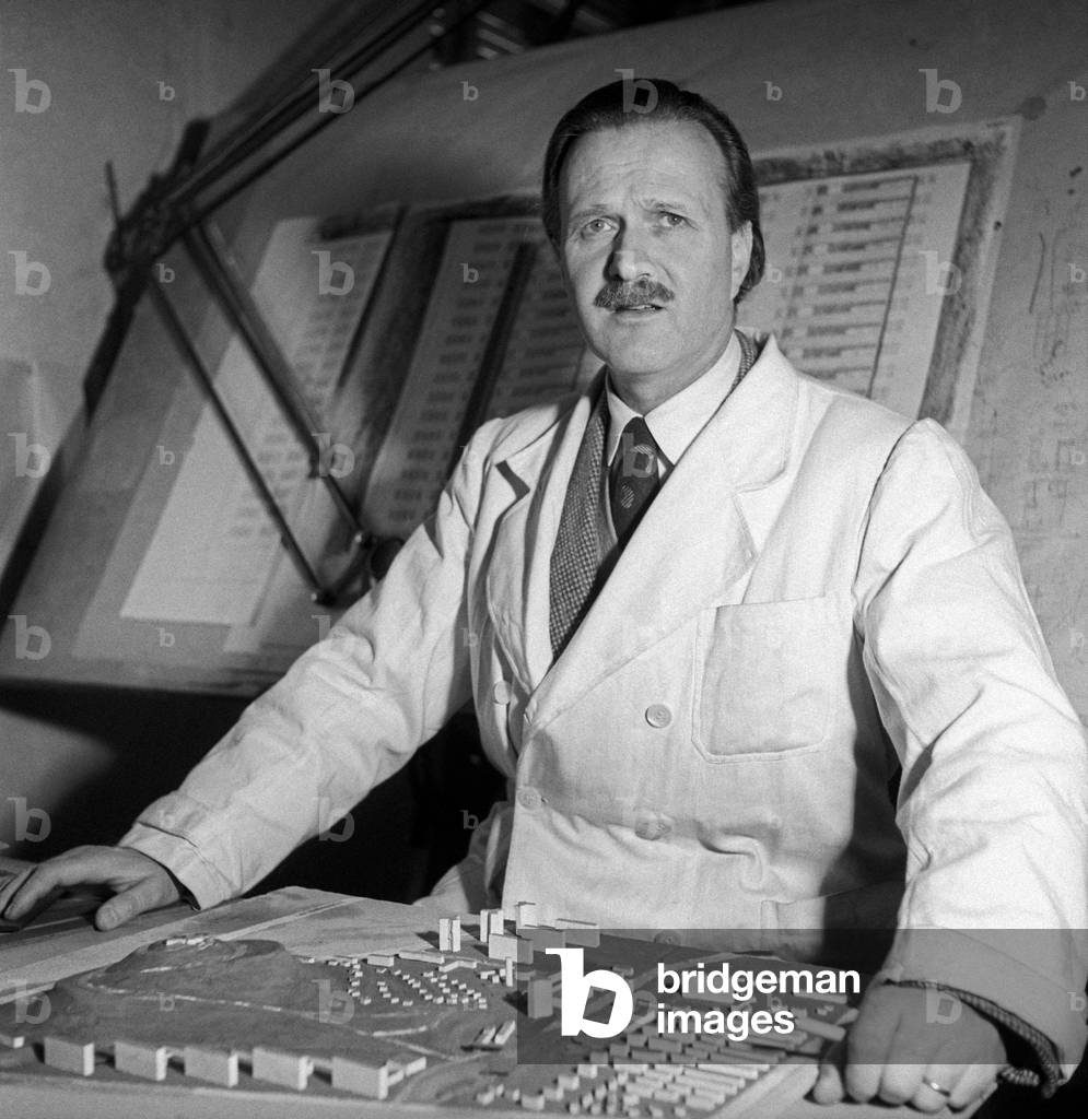 Piero Bottoni seated near a scale model,  Milan, Italy