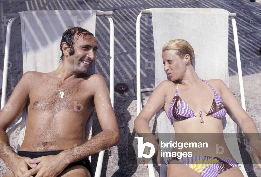 Pippo Baudo sitting on a deckchair with his wife, Ustica, Italy