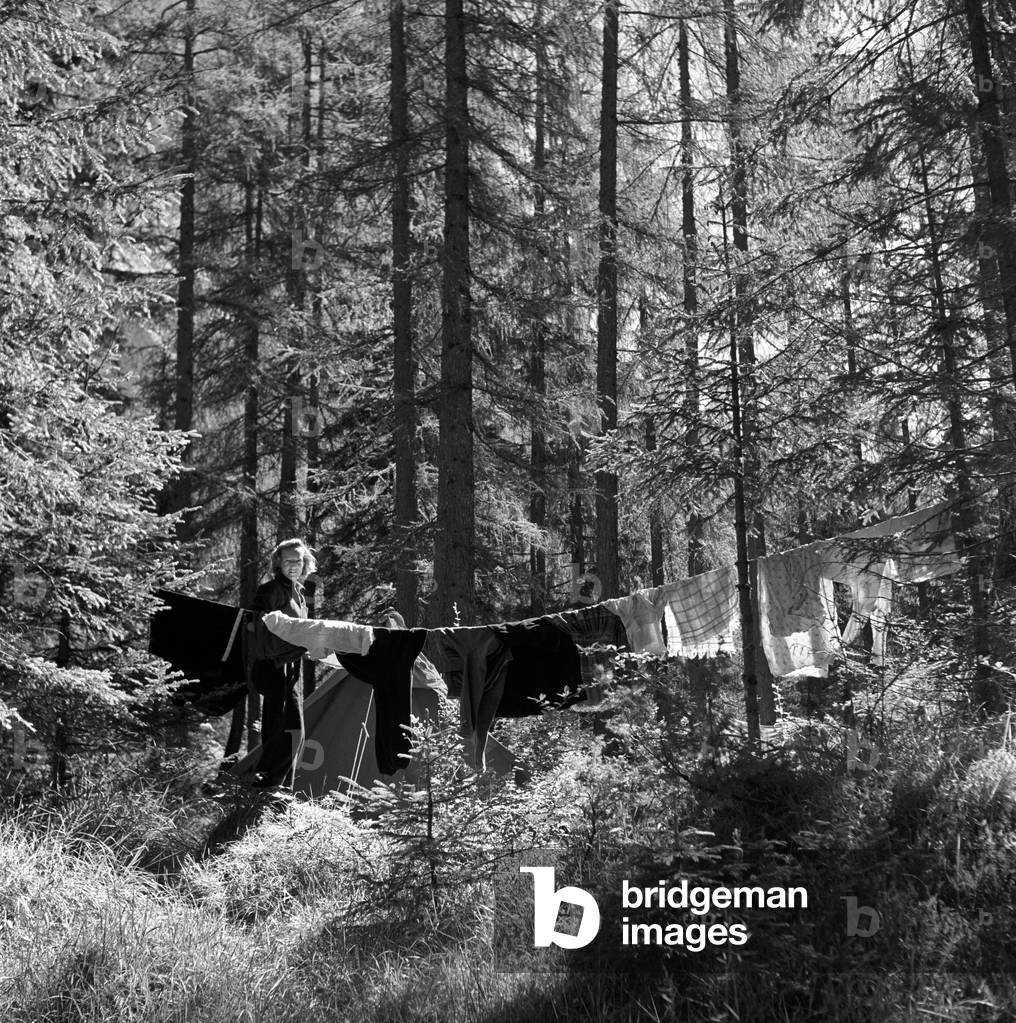 A girl hanging the washing out , Cortina d'Ampezzo, Italy