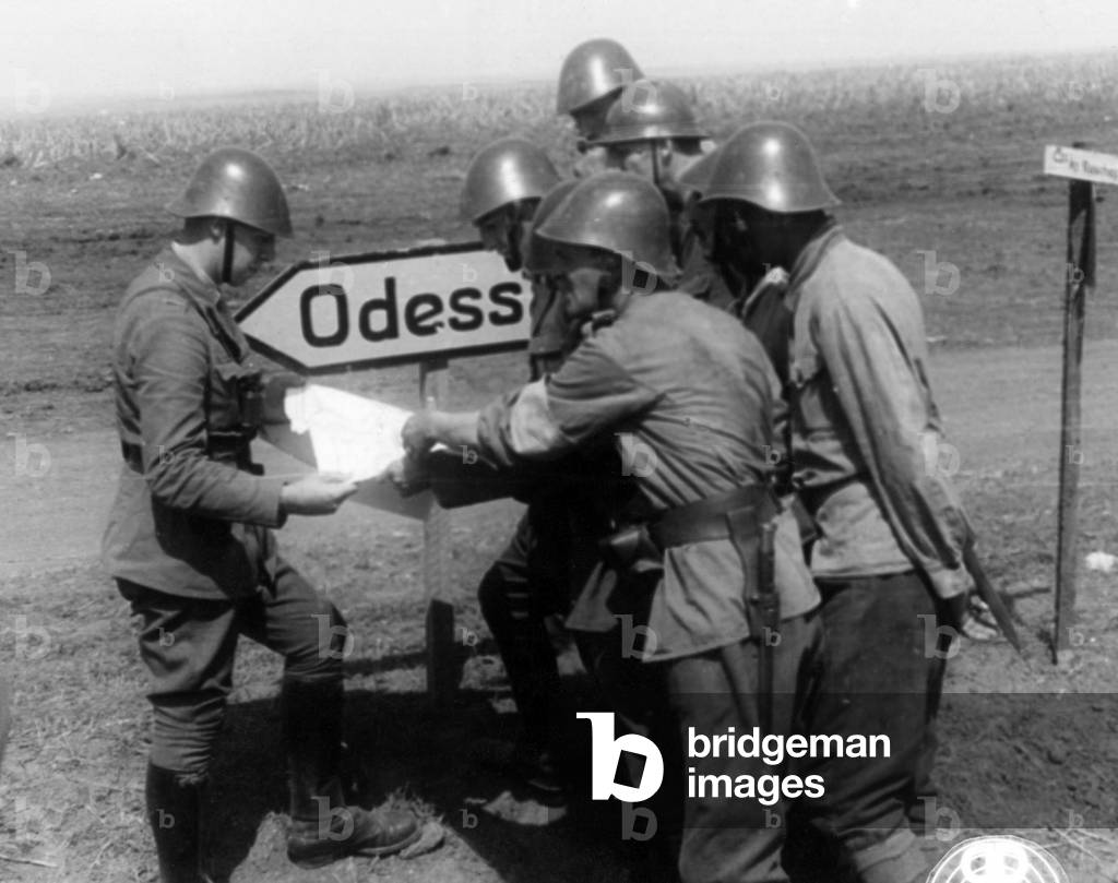 Romanian soldiers studying a map