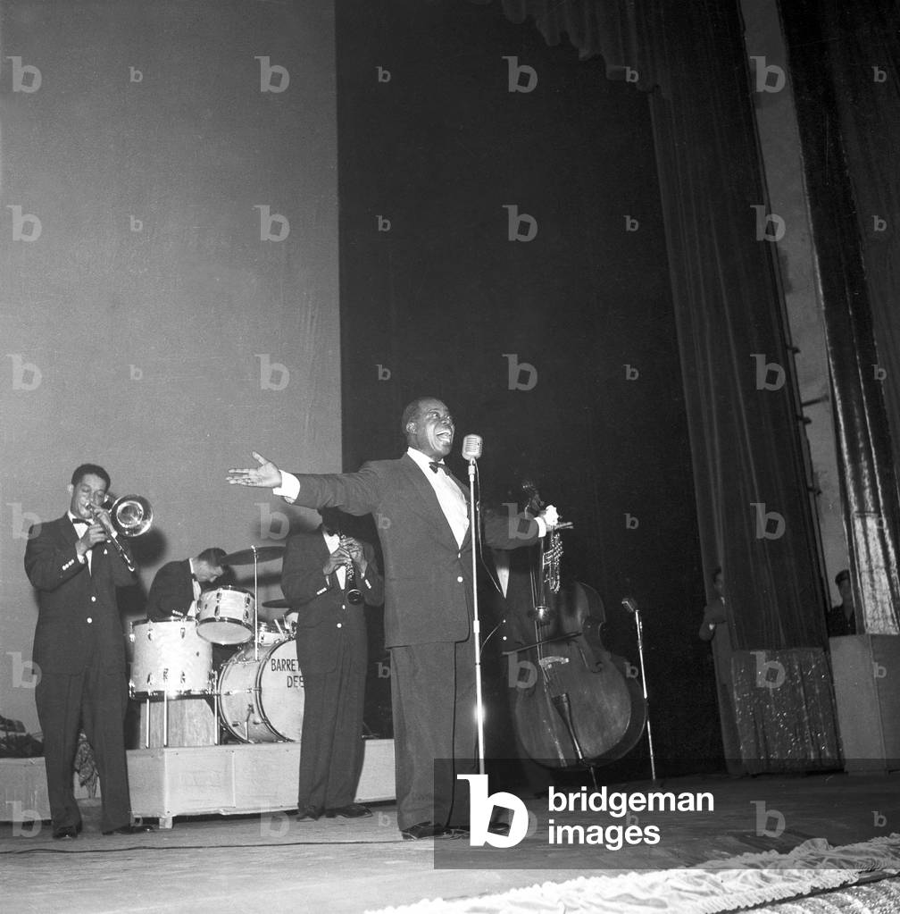 Louis Armstrong during a concert at the Teatro Sistina, Rome, Italy, 1956 (b/w photo)