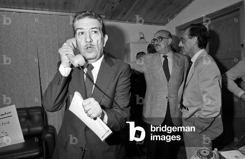Franco Evangelisti speaking on the telephone