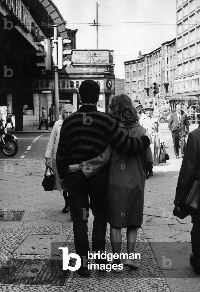 A couple in the streets of East Berlin