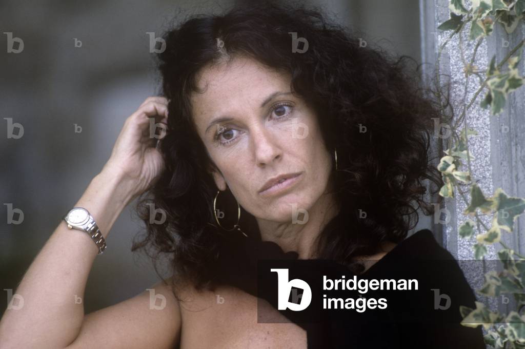 Valeria D'Obici tidying her hair, Italy, 1986