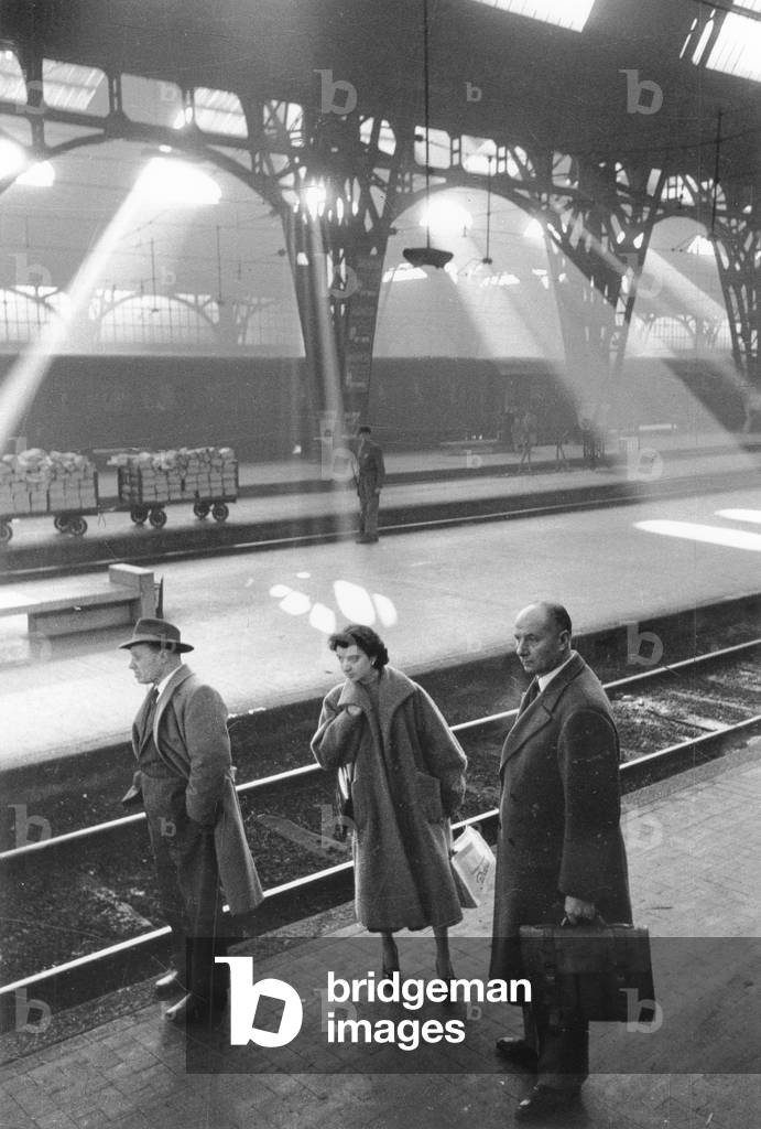 Travellers at the Central Station of Milan, Italy, 1950 (b/w photo)