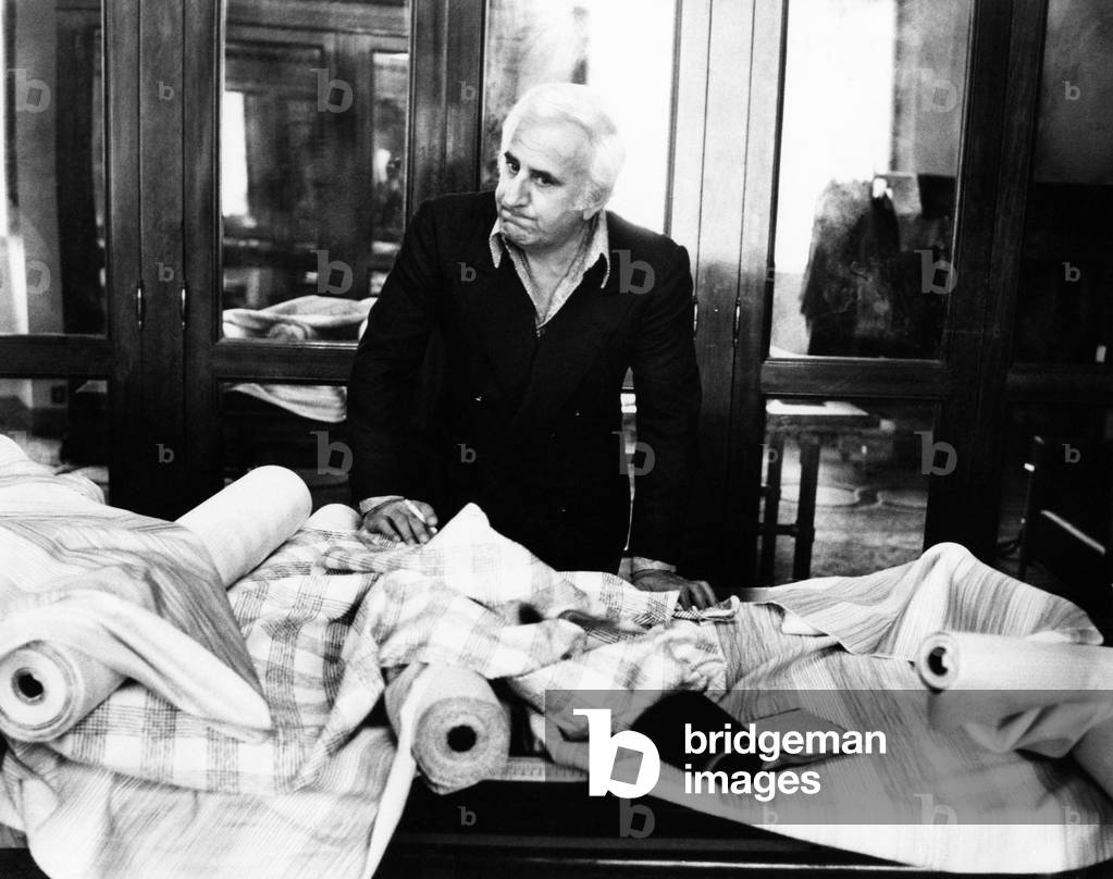 Adolfo Celi in a dressmaker's shop, 1970 (b/w photo)