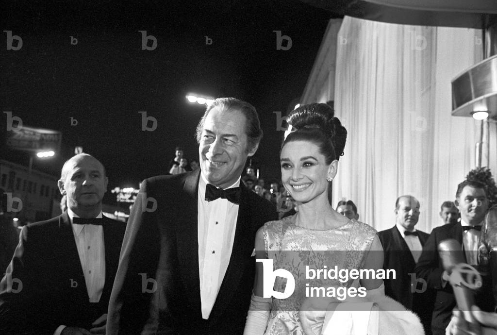 Rex Harrison and Audrey Hepburn at the premiere of the film My Fair Lady (b/w photo)