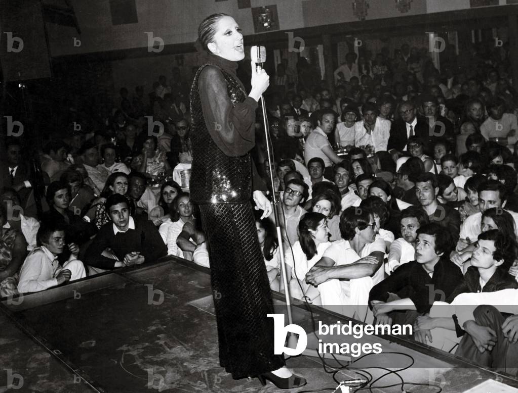 Mina sings in a club, Italy