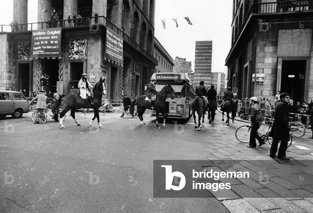 People riding horses on piazza del Duomo in Milan,  Milan, Italy
