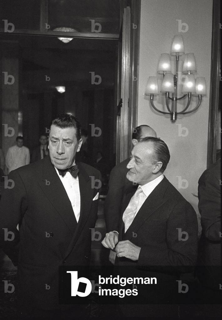 Totò and Fernandel are coming out from a theatre where the film 'The Law Is the Law' was premièred,, 1958